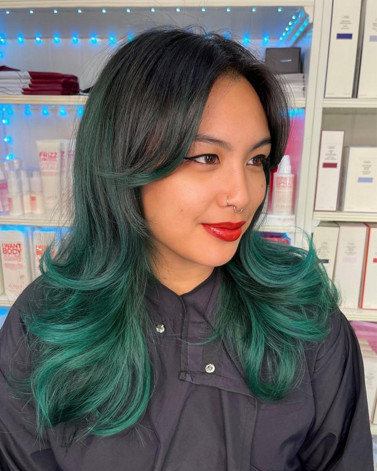 Green Balayage Blow Out And Curtain Bangs