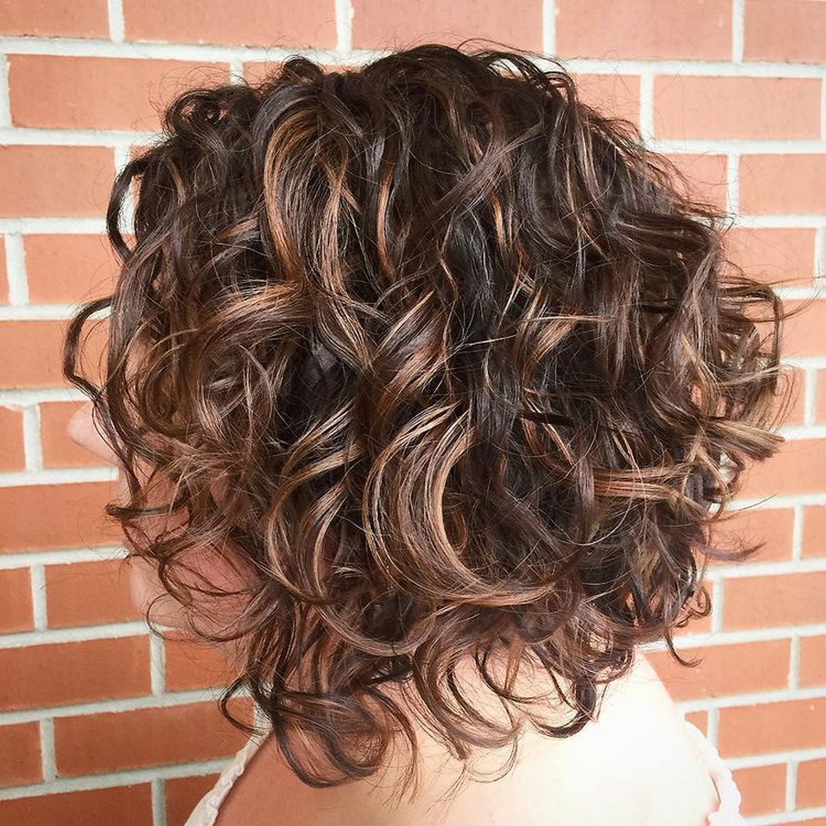 Curly Chocolate Bob With Caramel Highlights