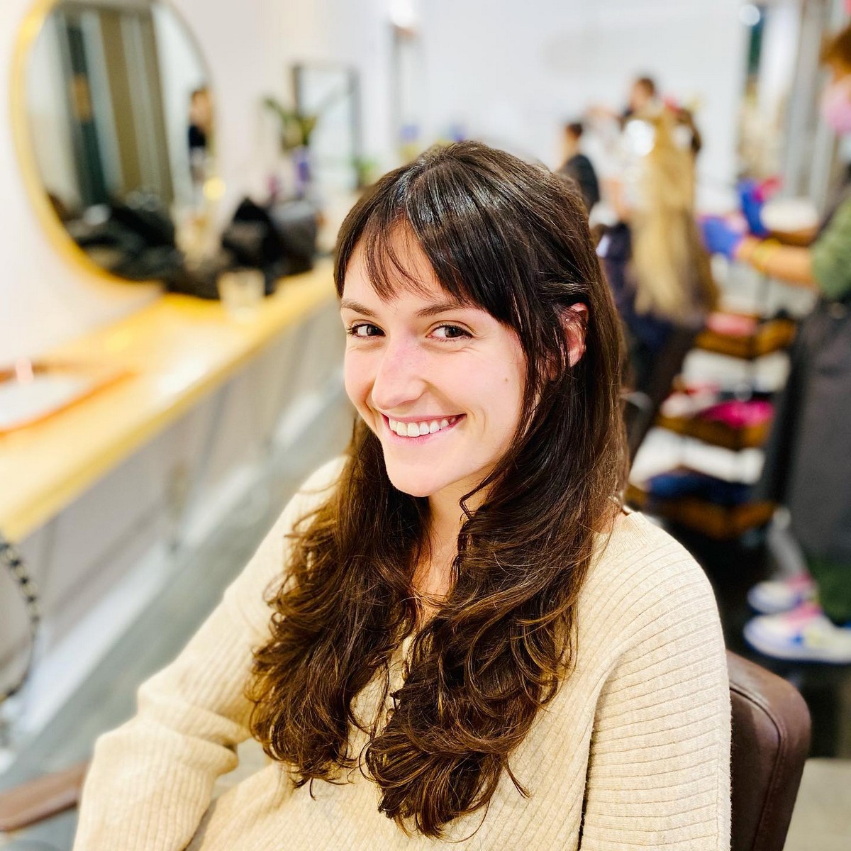 Layered Chestnut Haircut And French Bangs