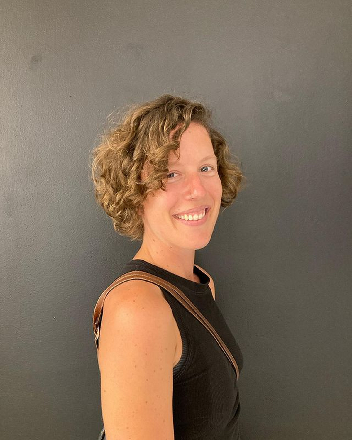 Curly Bob With Side-Swept Bangs