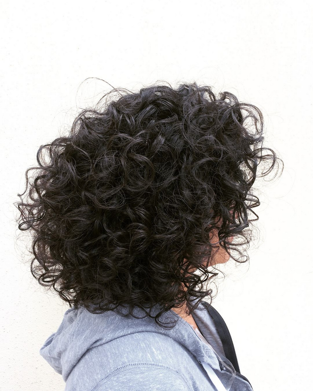 Medium Voluminous Hairstyle with Bouncy Curls