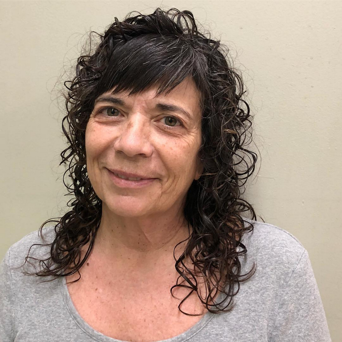 Curly Layered Hair With Choppy Bangs