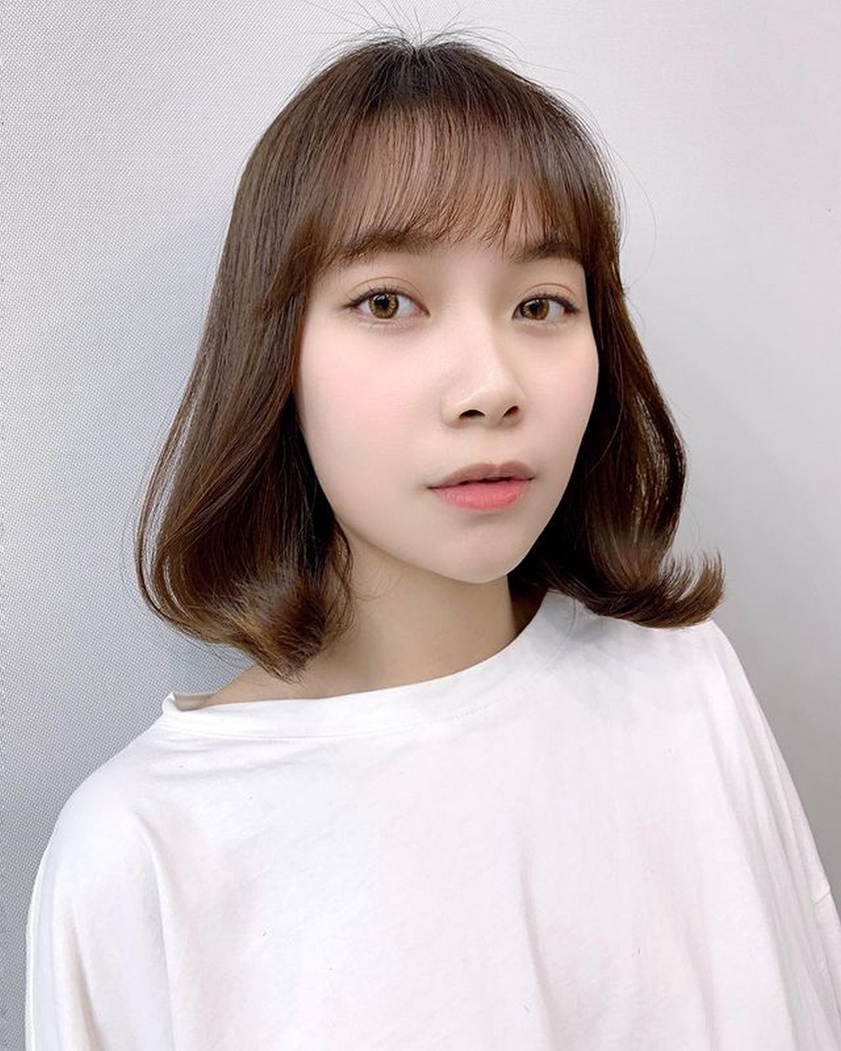 Medium-Length Cut with Transparent Bangs