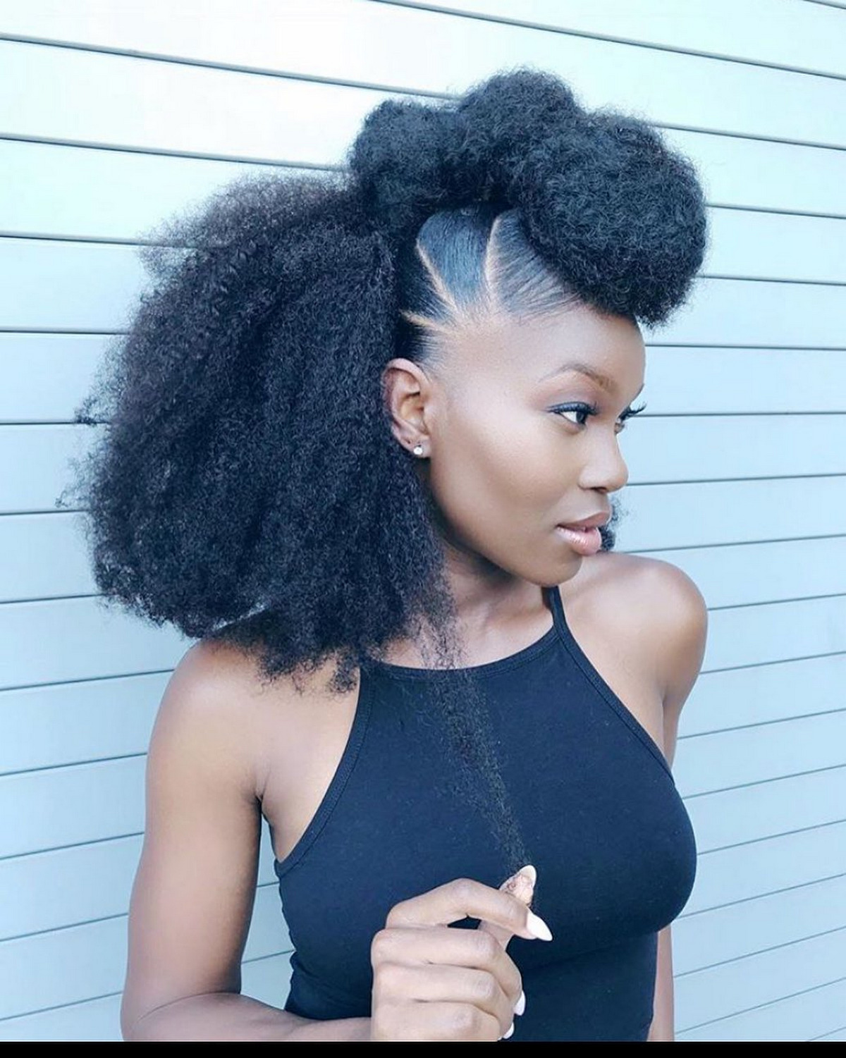 Faux hawk hairstyle with tight curls