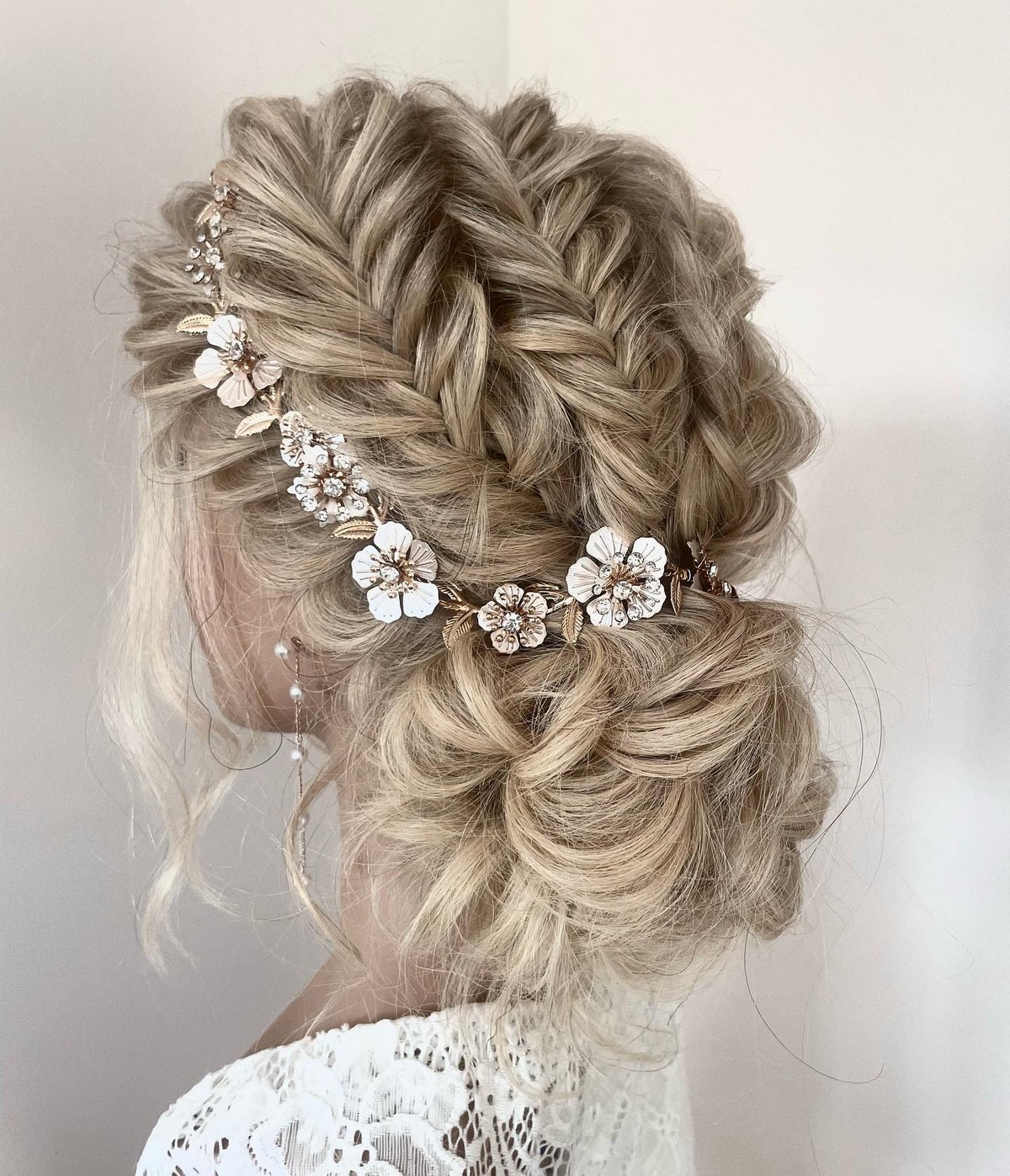 Tucked-In Updo With Floral Hair Vine