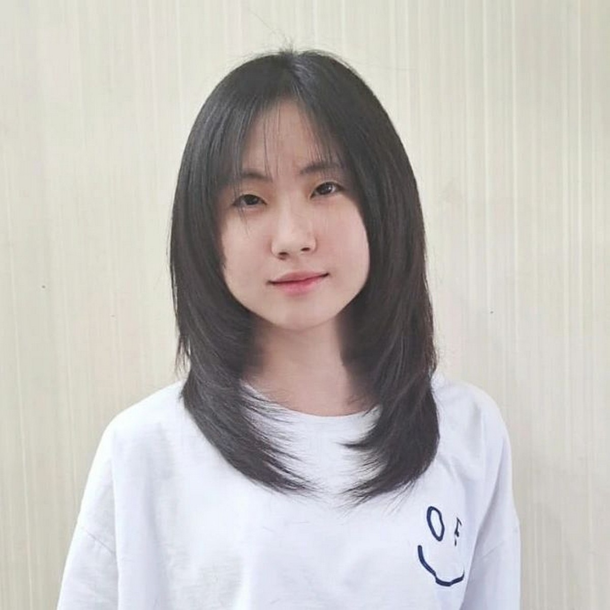 Medium-Length Hair With Face-Framing Layers And Wispy Bangs