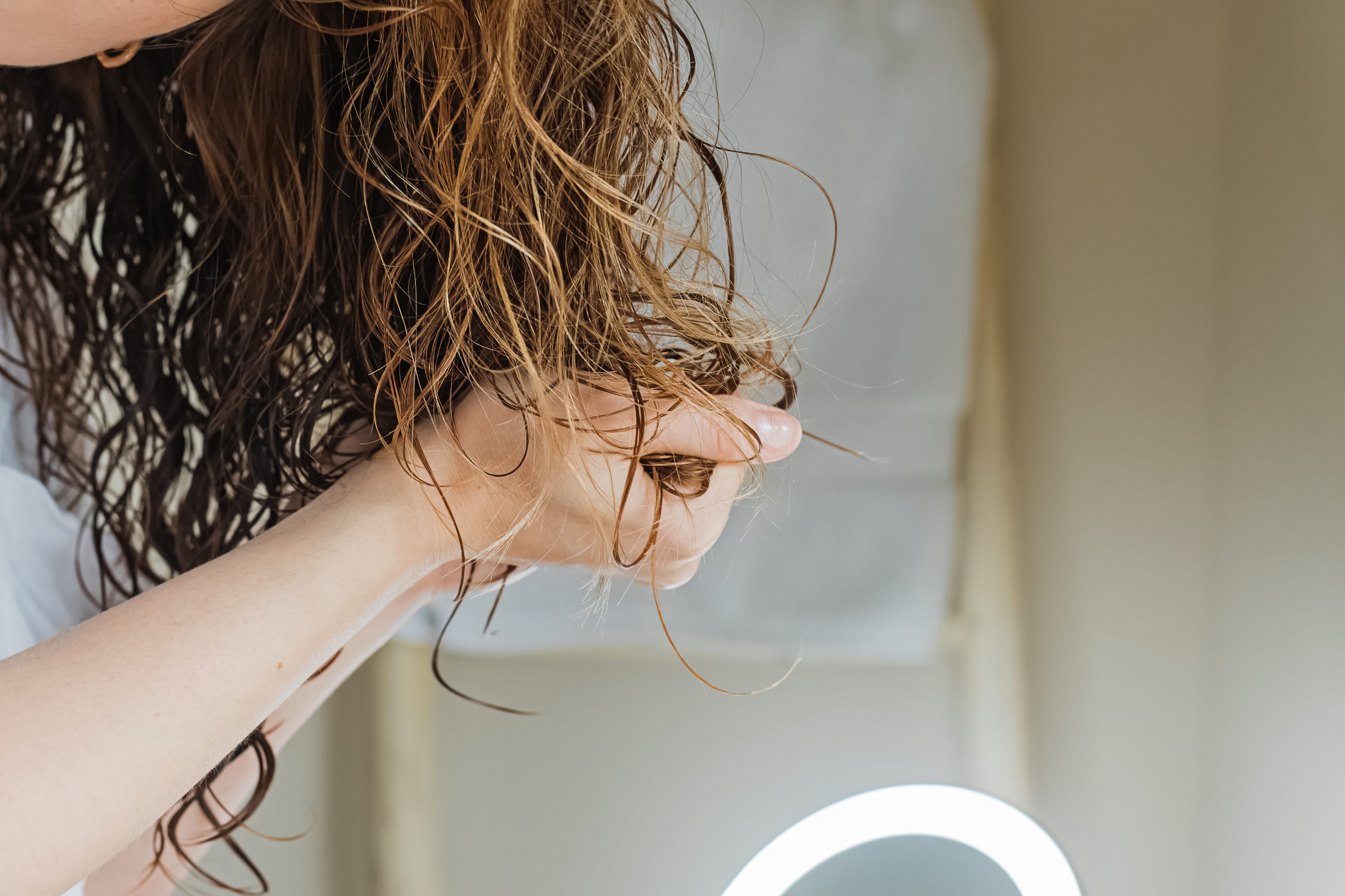 Apply a curl-enhancing product
