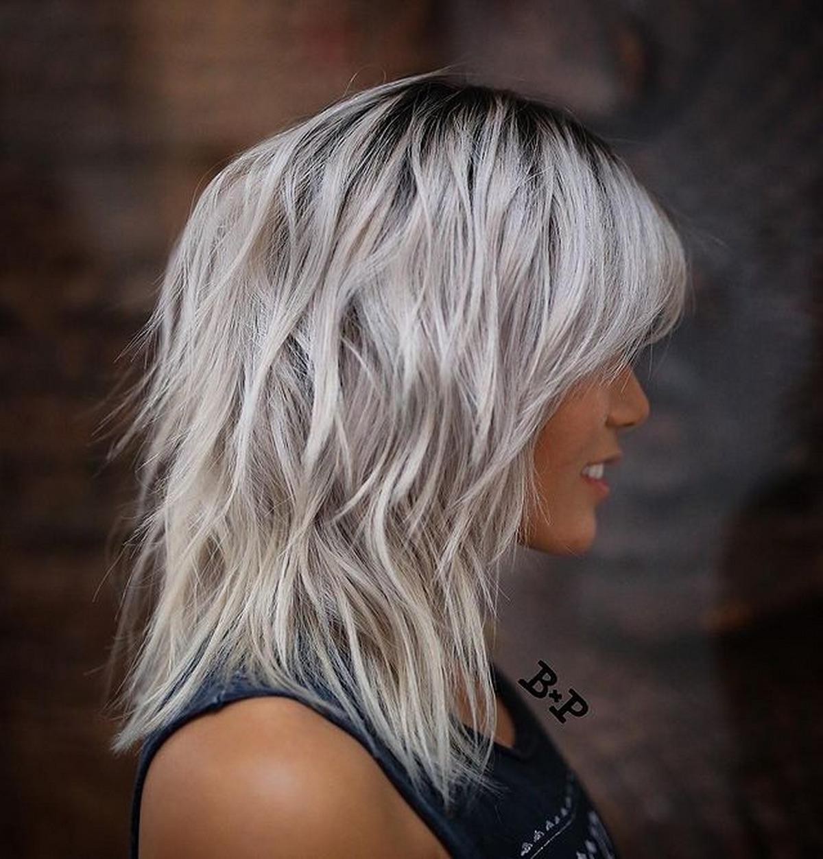Medium-Length Ash Blonde Shag With Bangs