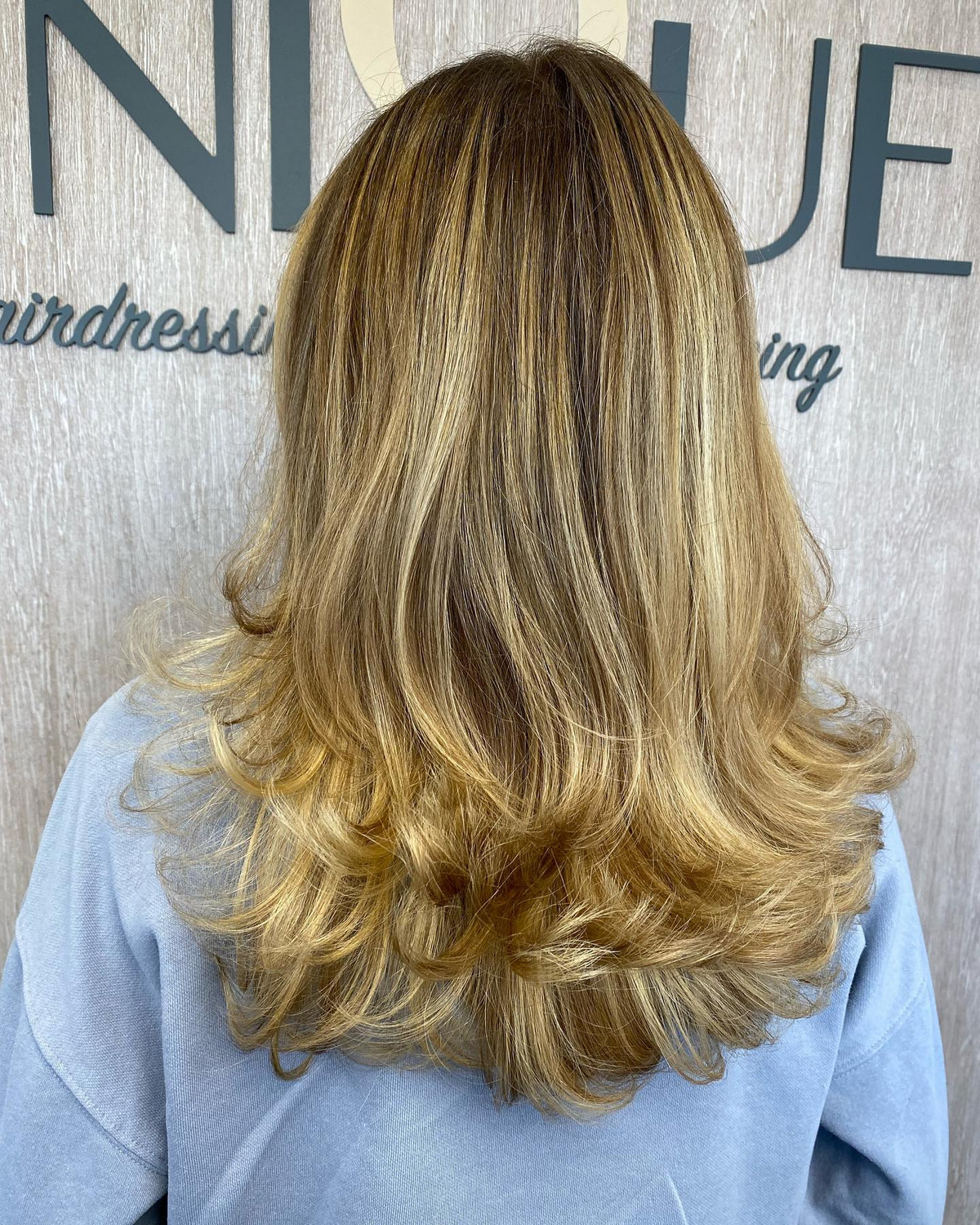 Long Blonde Layered Haircut With Textured Ends 