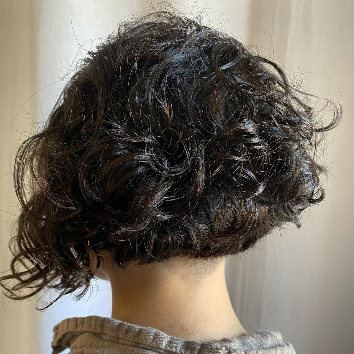 Curly Asymmetric Stacked Bob