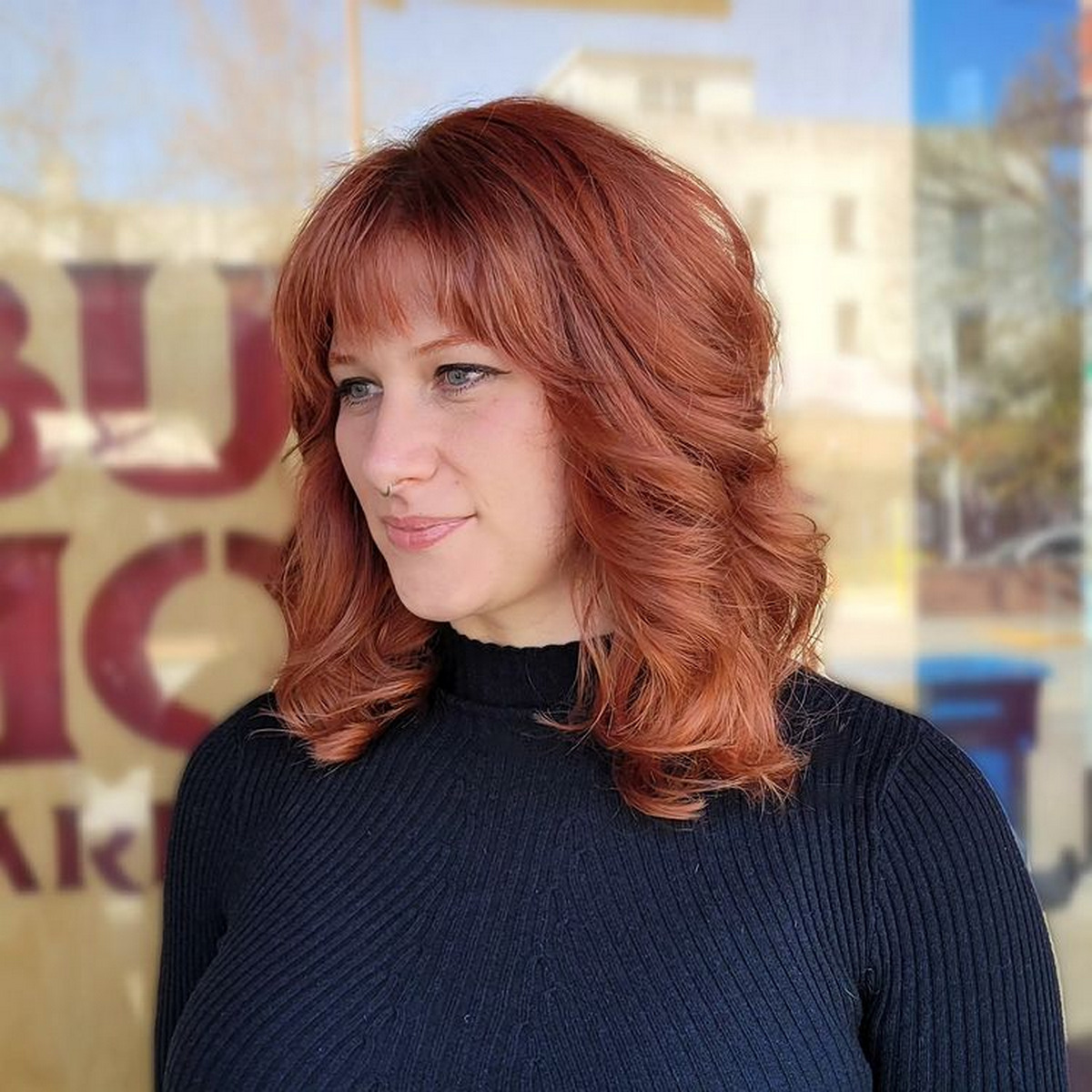Curly Red Medium-Length Hair With Blunt Bangs