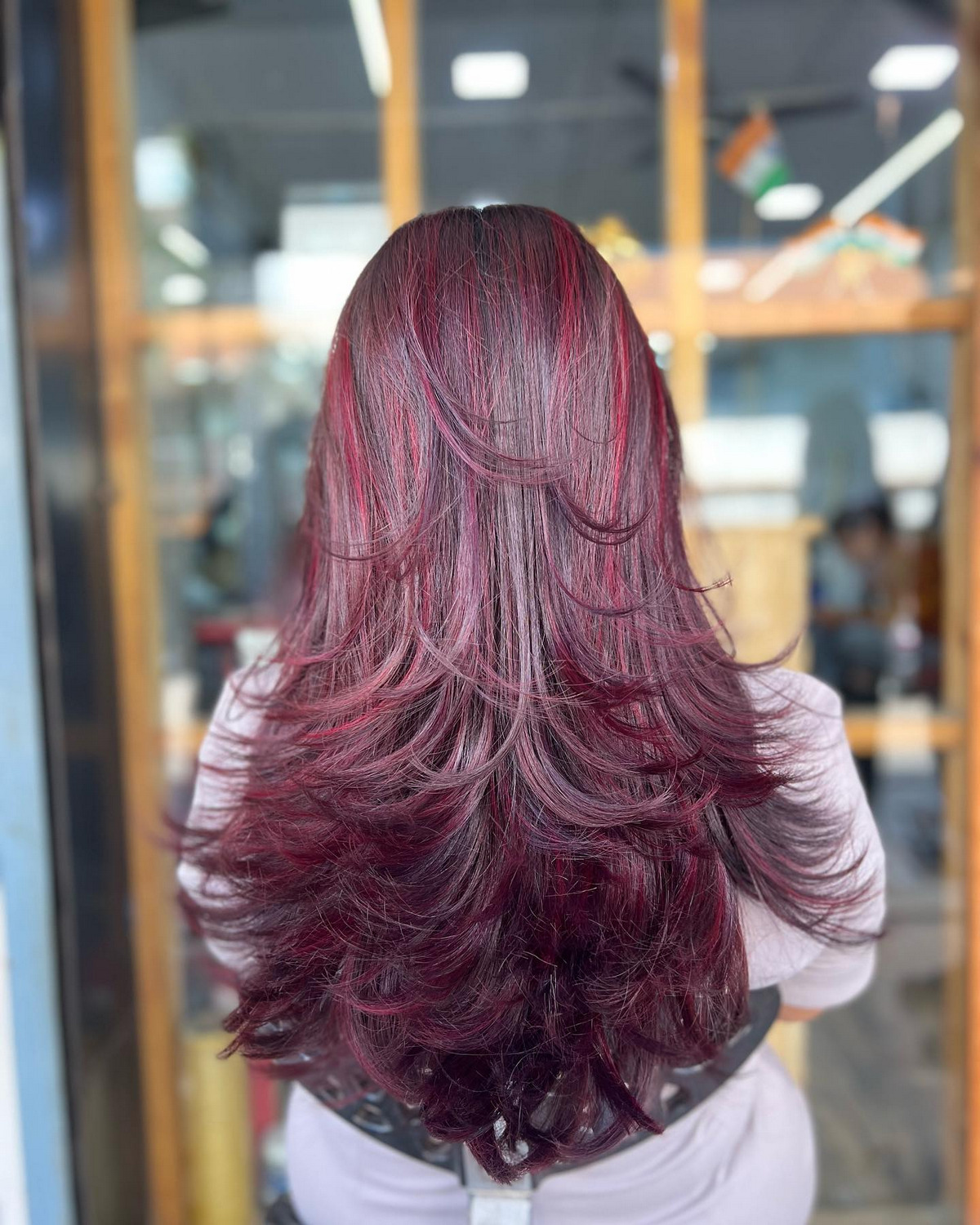 Wine Red Highlights With Long Layers Cut