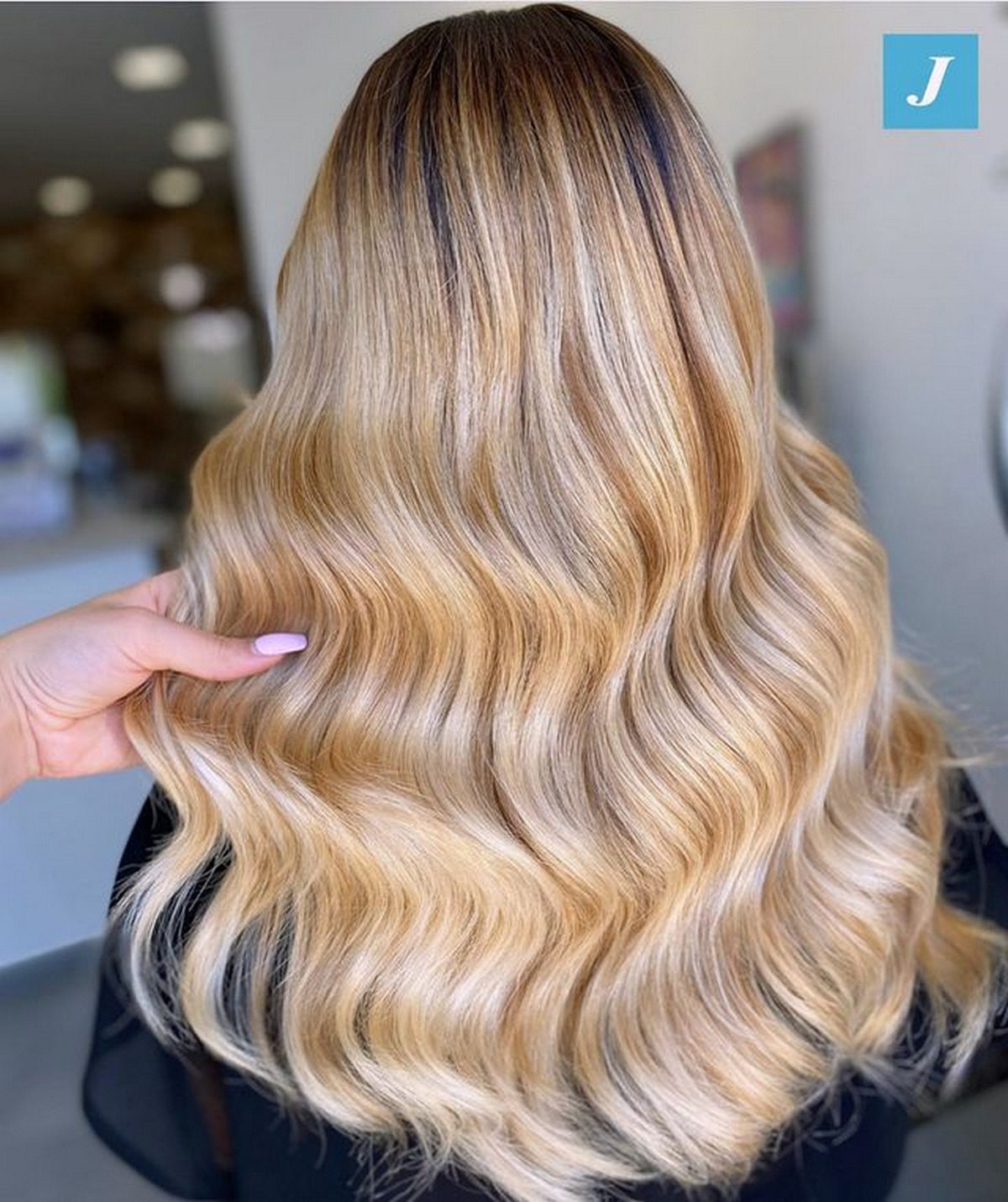 Medium-Length Wavy Blonde Hair With Shadow Roots