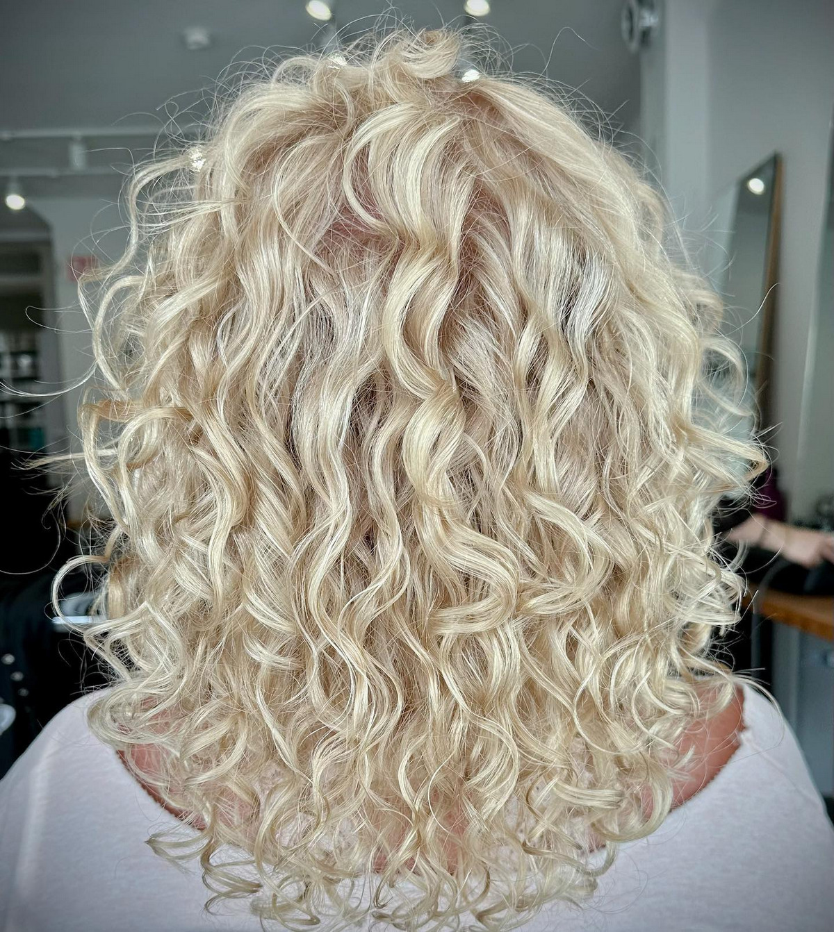 Platinum Blonde Curly Hair With Bright Honey Highlights