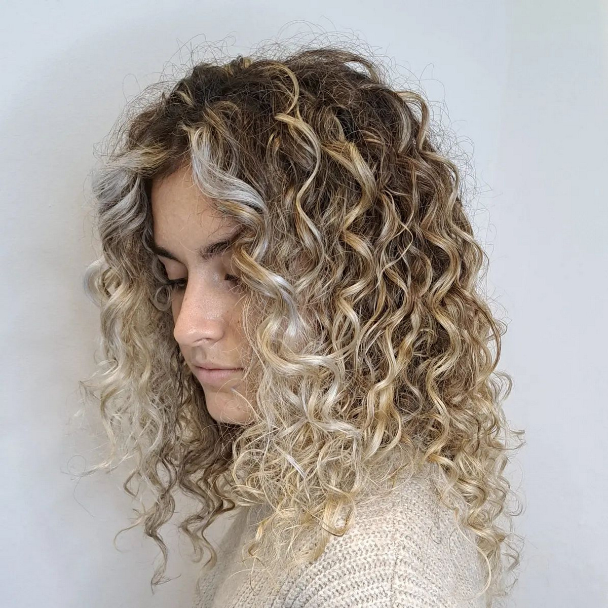 Champagne Blonde Balayage On Curly Hair