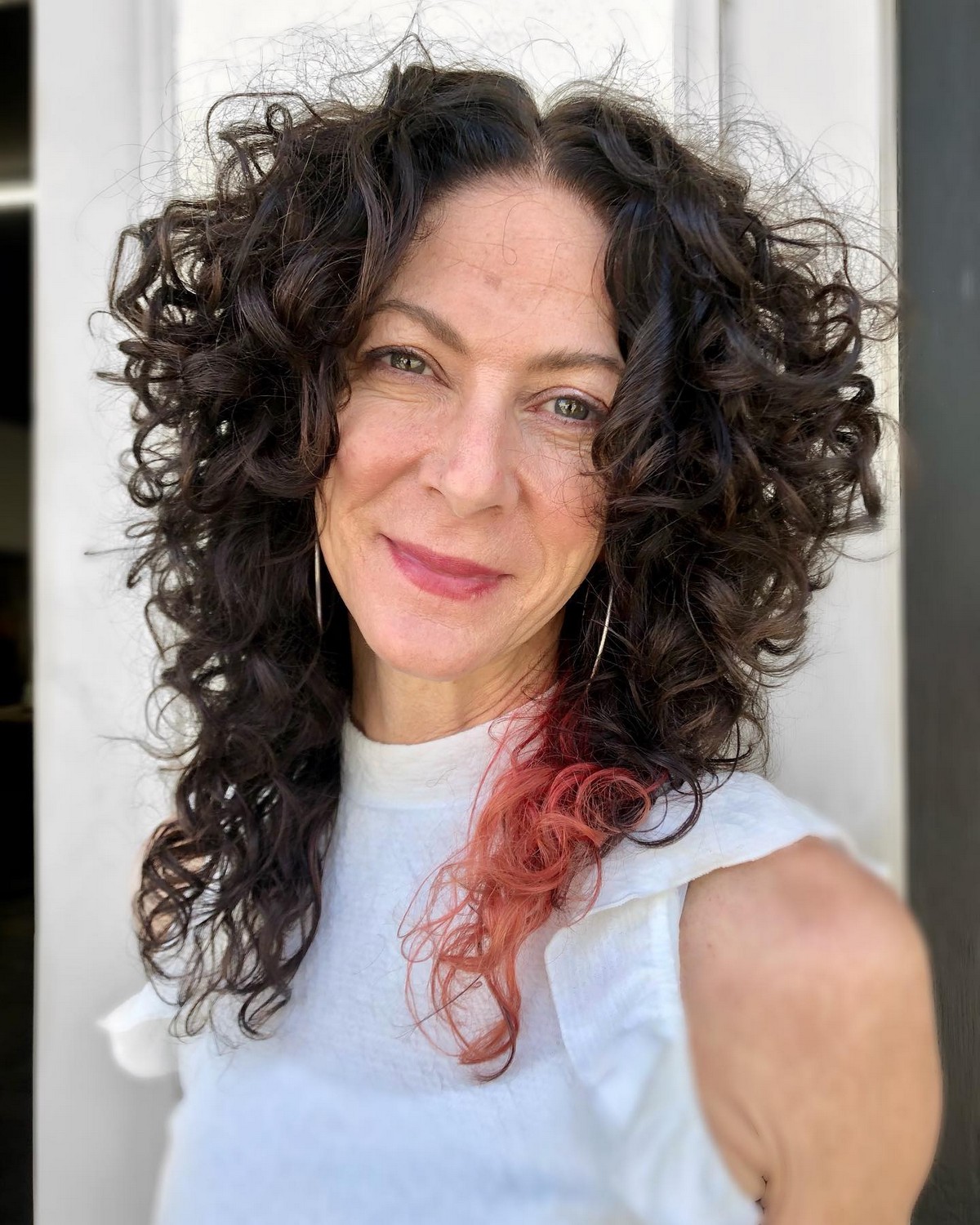 Natural Curly Middle-Parted Haircut with Medium Layers