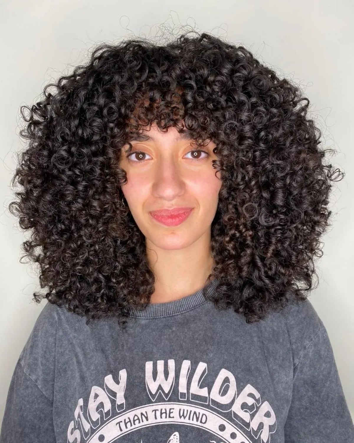 Voluminous Shoulder Length Curly Hair