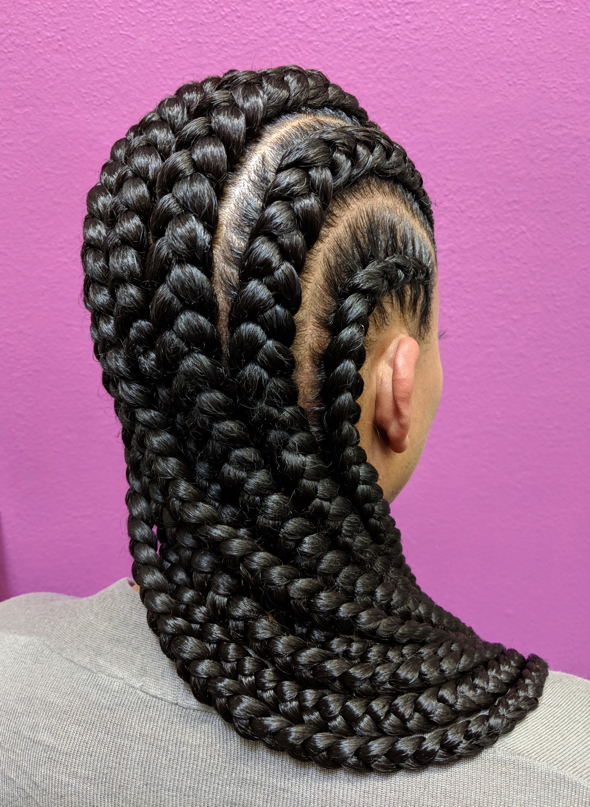 A Cornrow Hairstyle Using Black Synthetic Hair Extensions