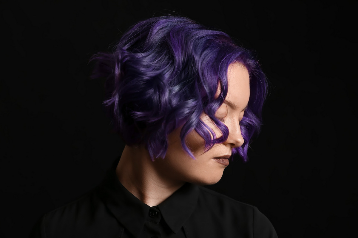 A beautiful young woman with purple hair