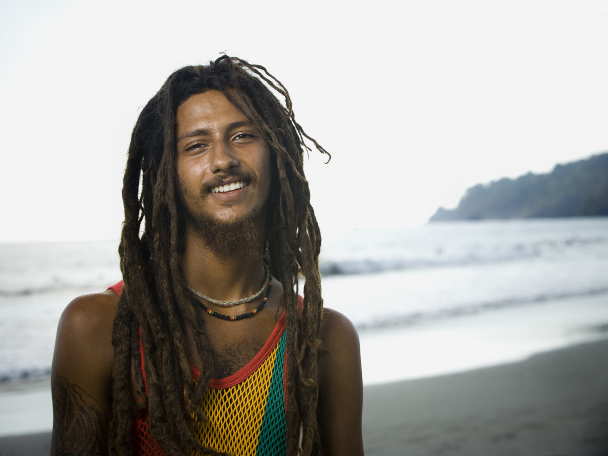 A young Rastafarian man with his thick, voluminous dreadlocks