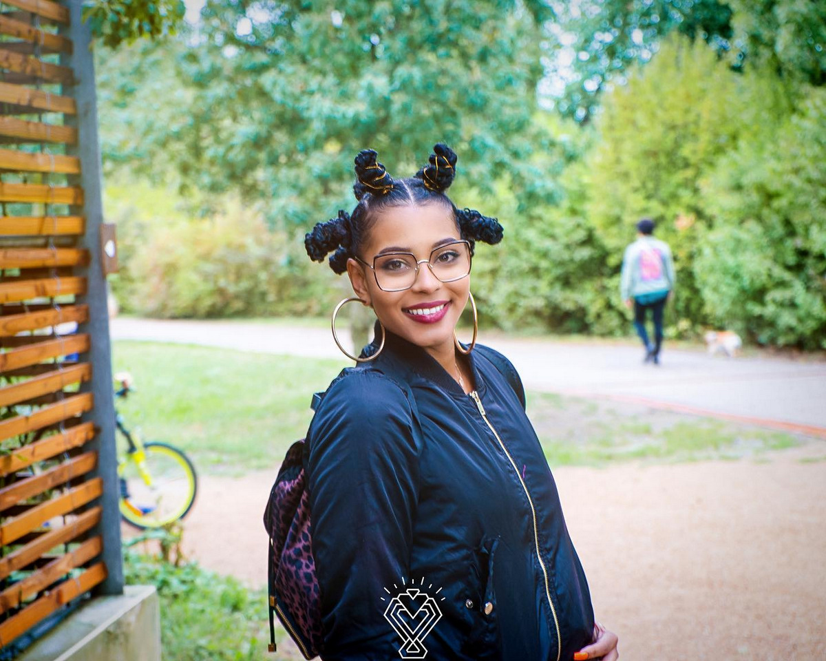 An active girl with bantu knots hairstyle