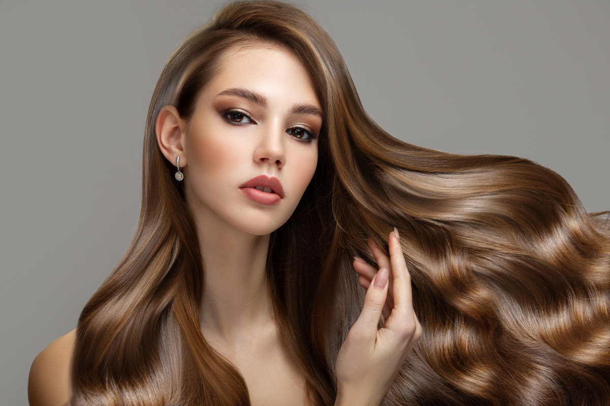 Beautiful brunette woman with long wavy hair