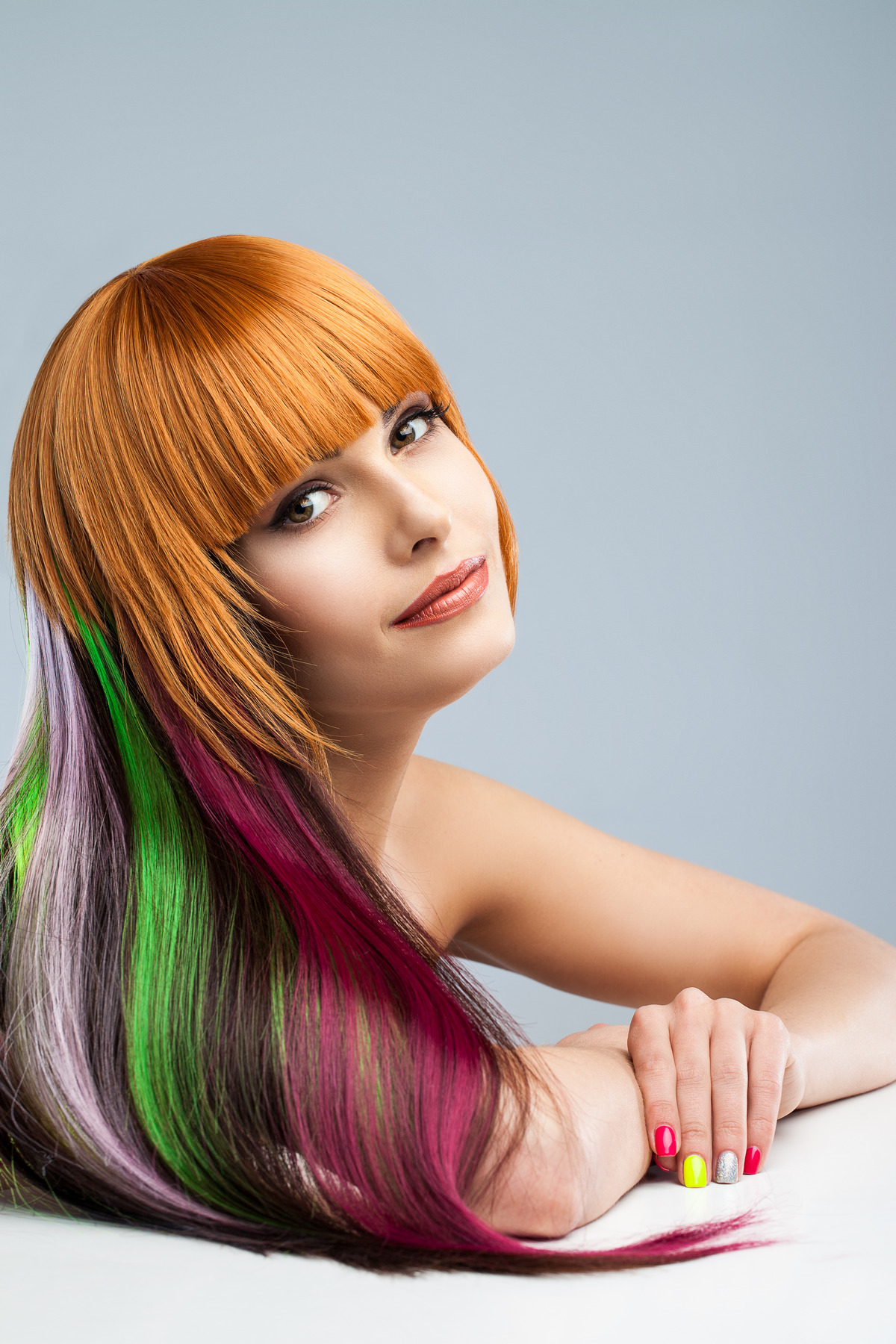 Beautiful woman with creative colored hair