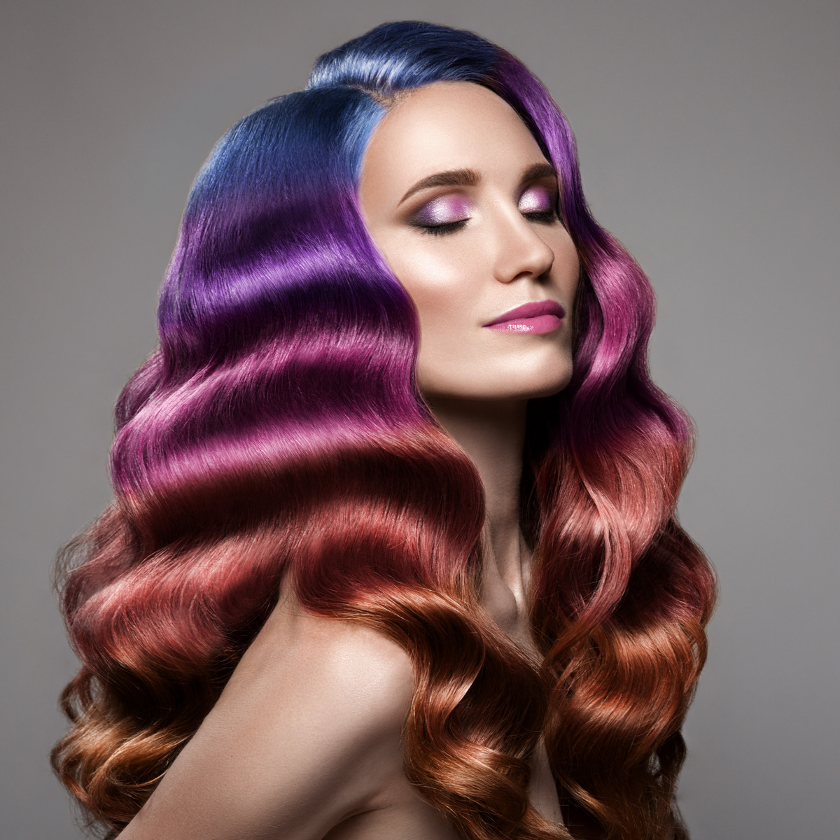 Beautiful woman with long curly colorful hair