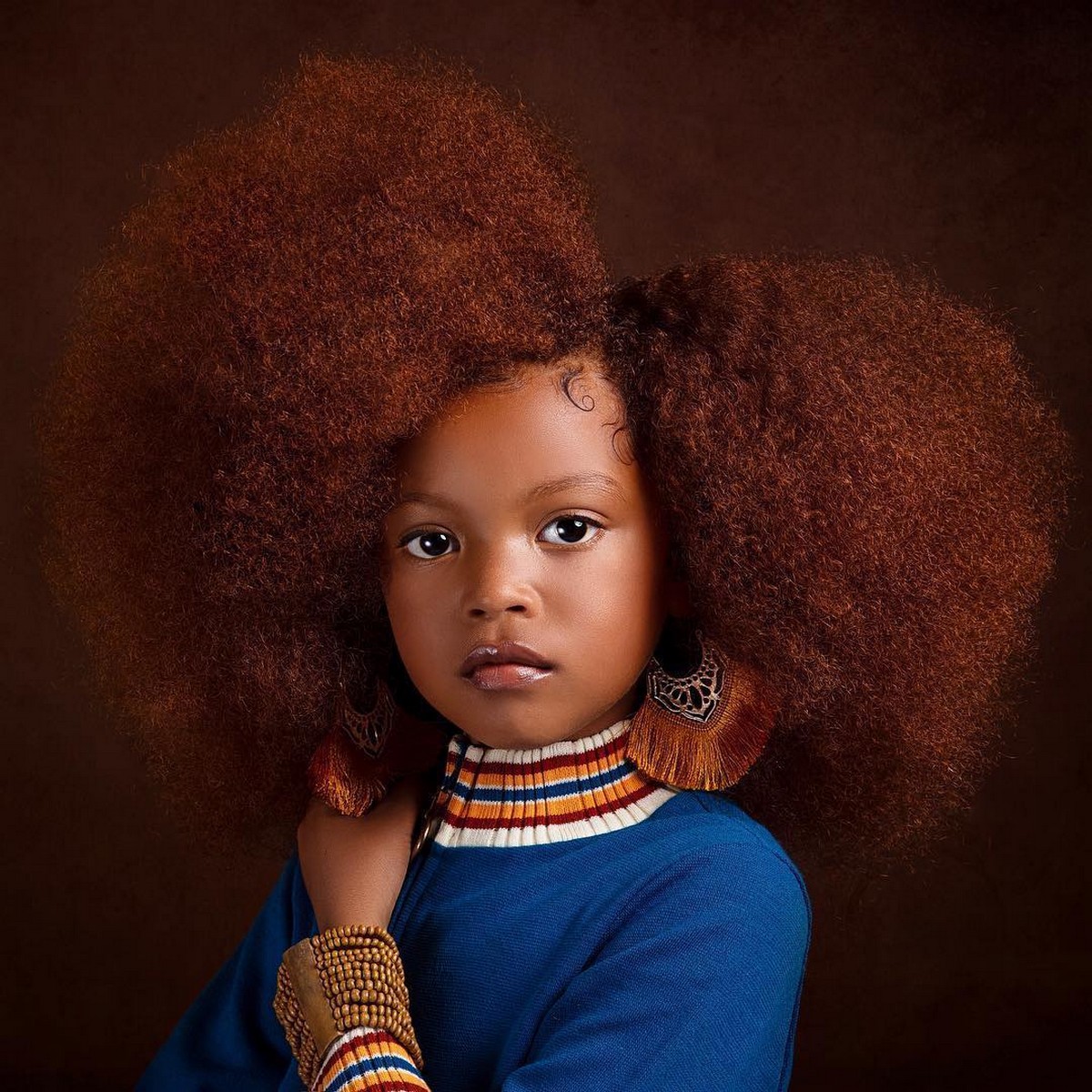 A Beautiful Black Baby Girl In Ginger Hair