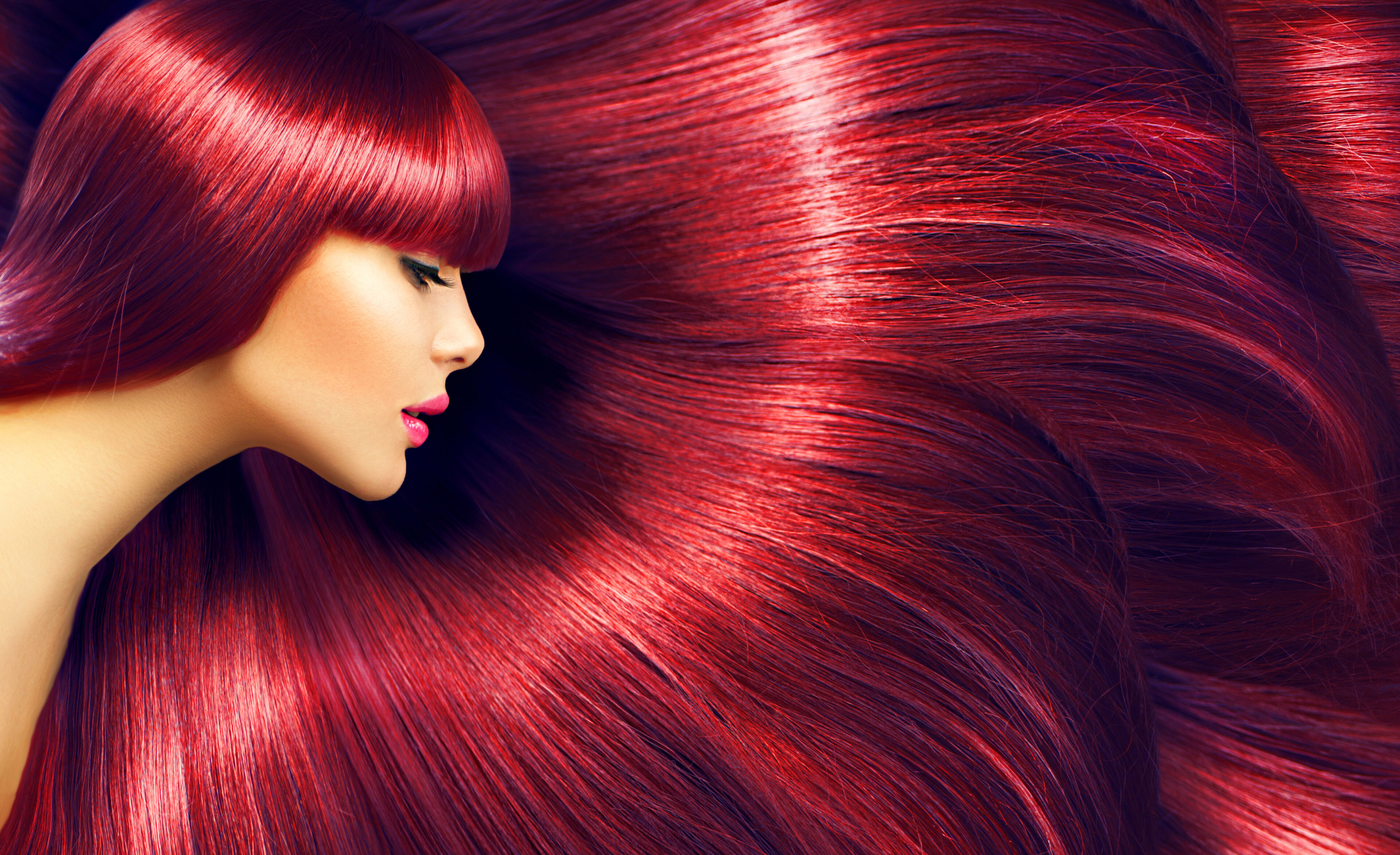 Beautiful woman with her dyed red hair