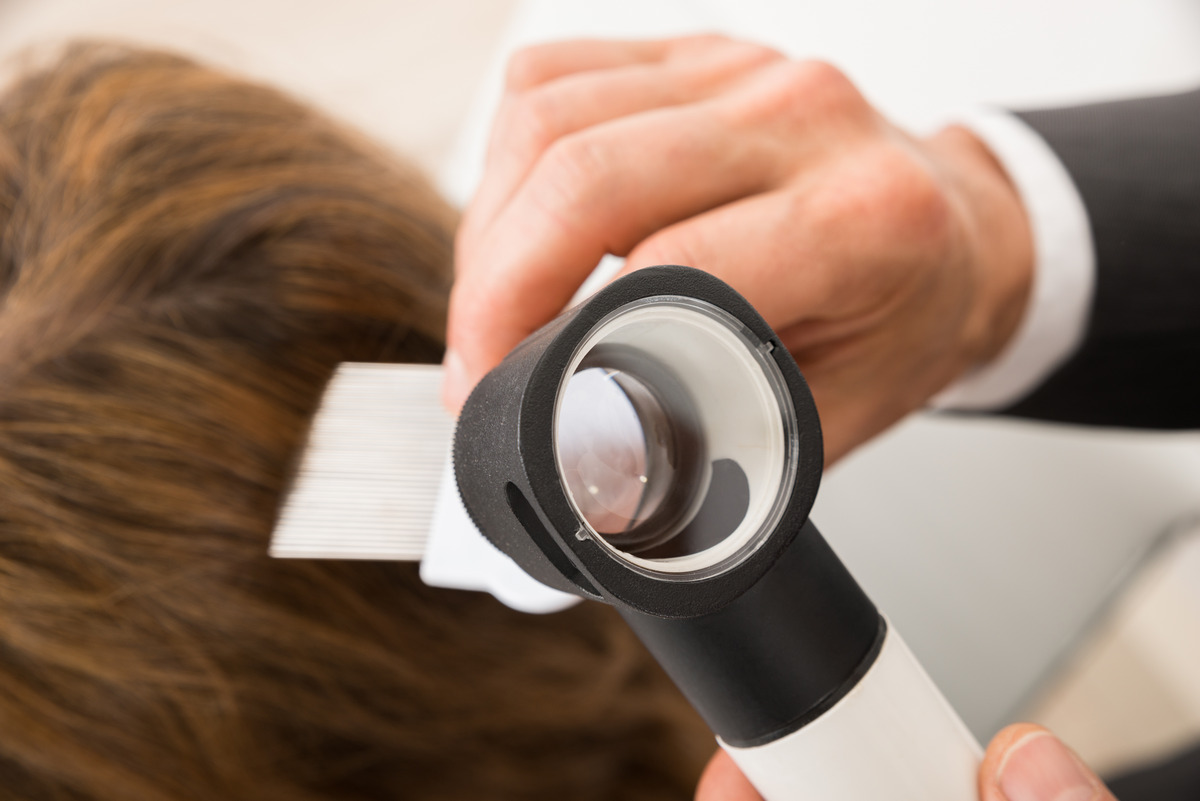 Close-up of Dermatoscope doing hair treatment 