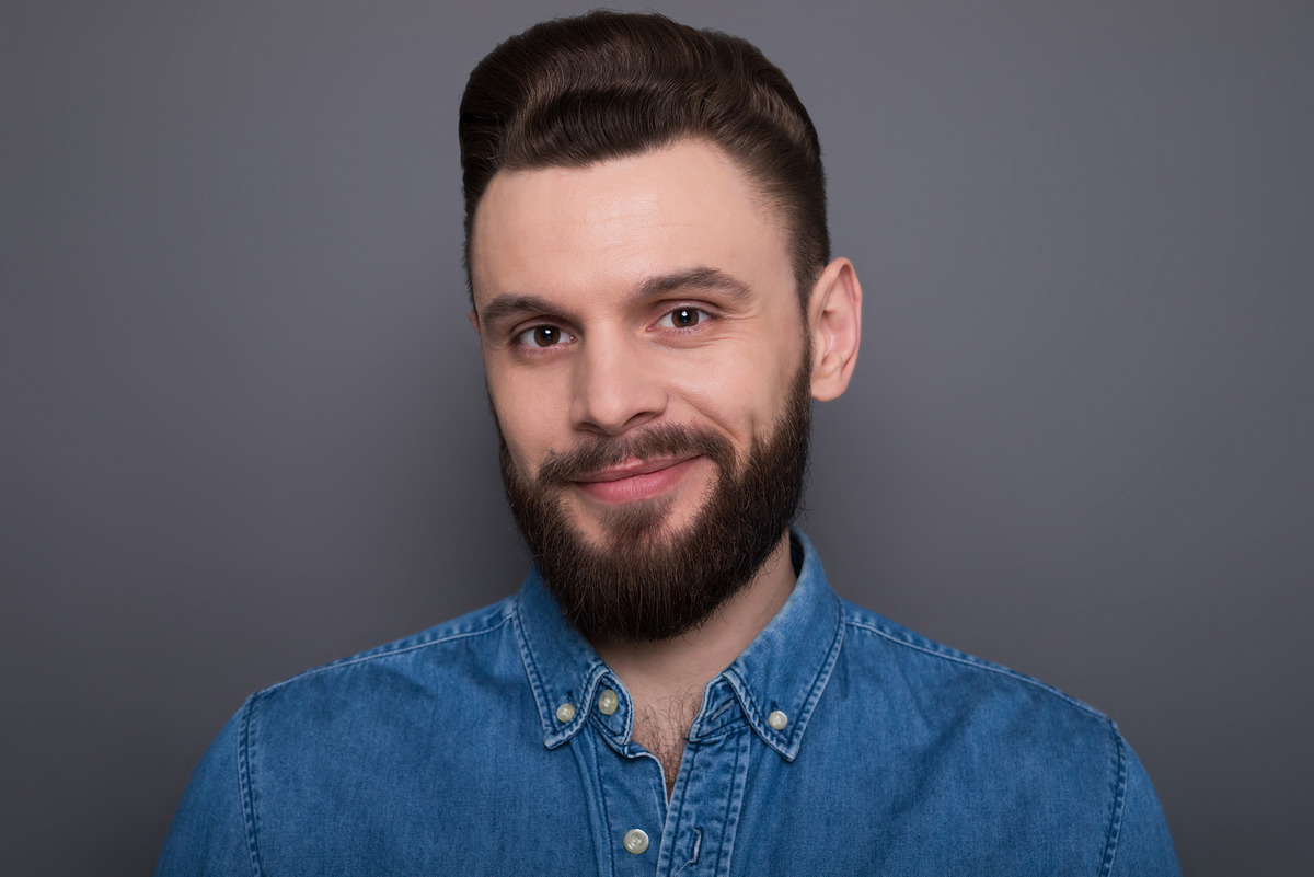 Confident serious bearded modern man