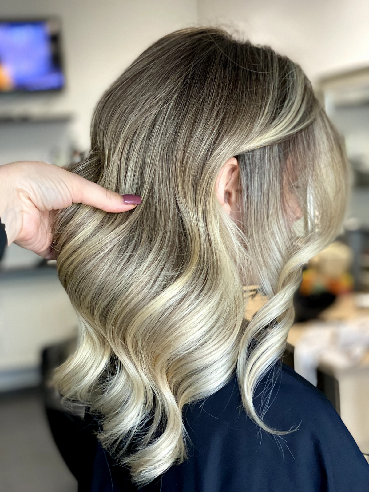 Girl with bouncy balayage hair with professional color technique
