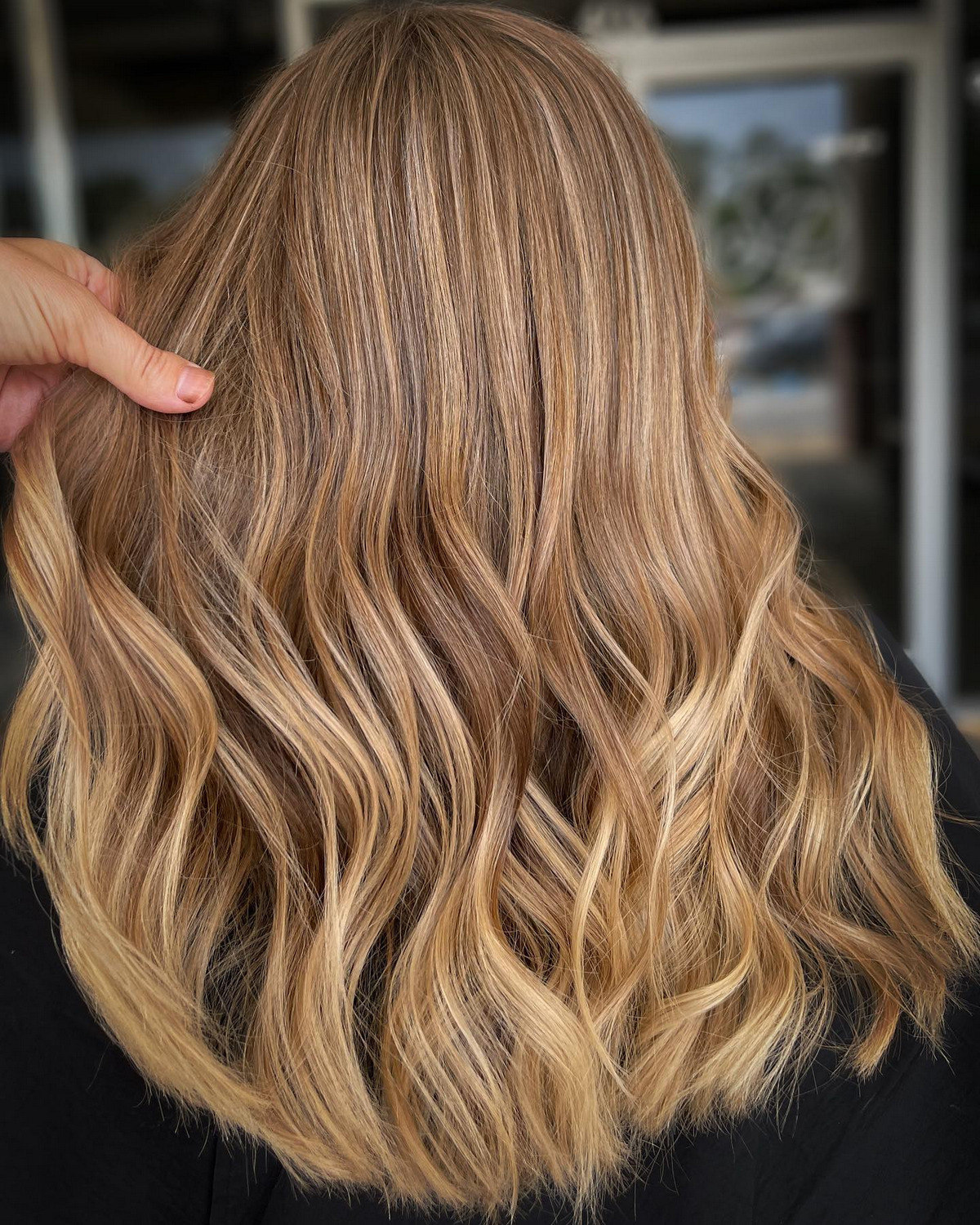 Girl with honey blonde balayage at home