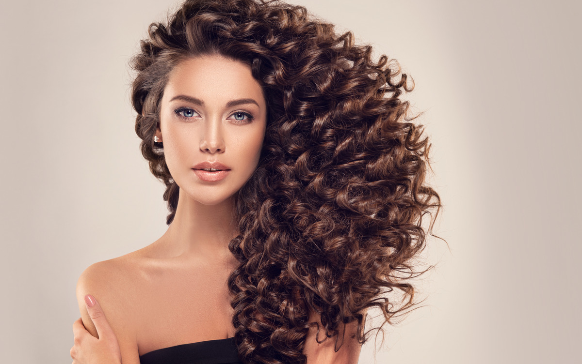 Girl with long and shiny curly hair