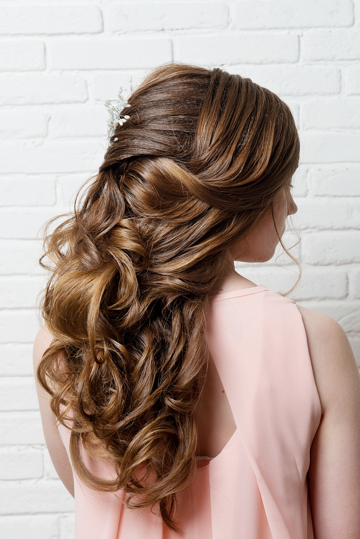 Girl's half up half down hairstyle.