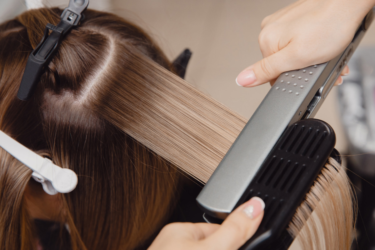 Hair straightening using a straightener and comb