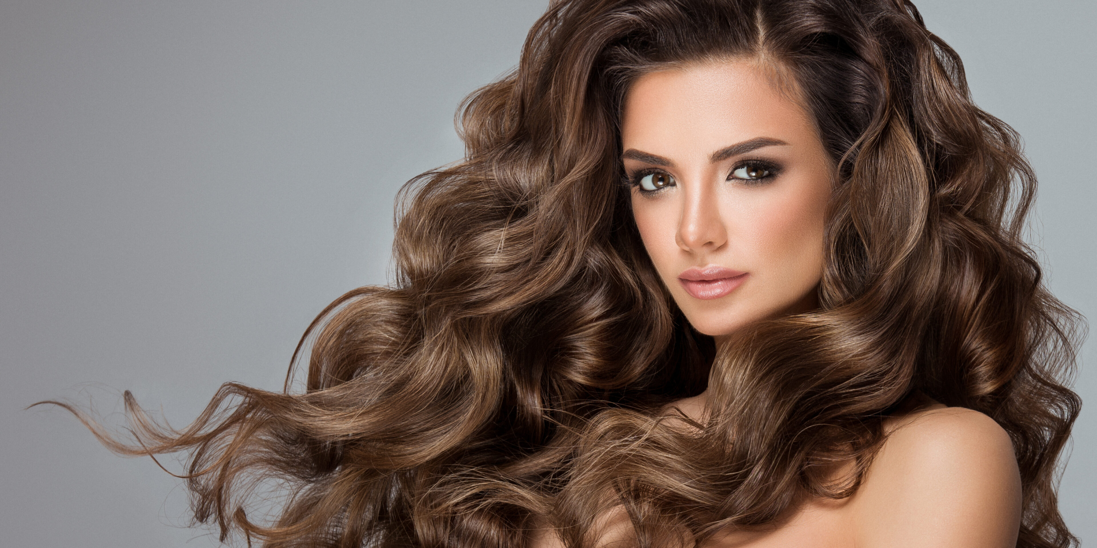 Beautiful girl with long and shiny wavy hair