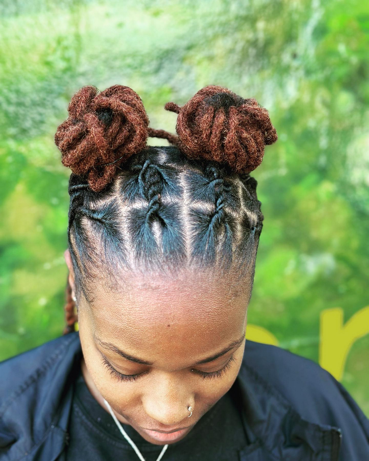 Loc extensions hairstyle with two knots