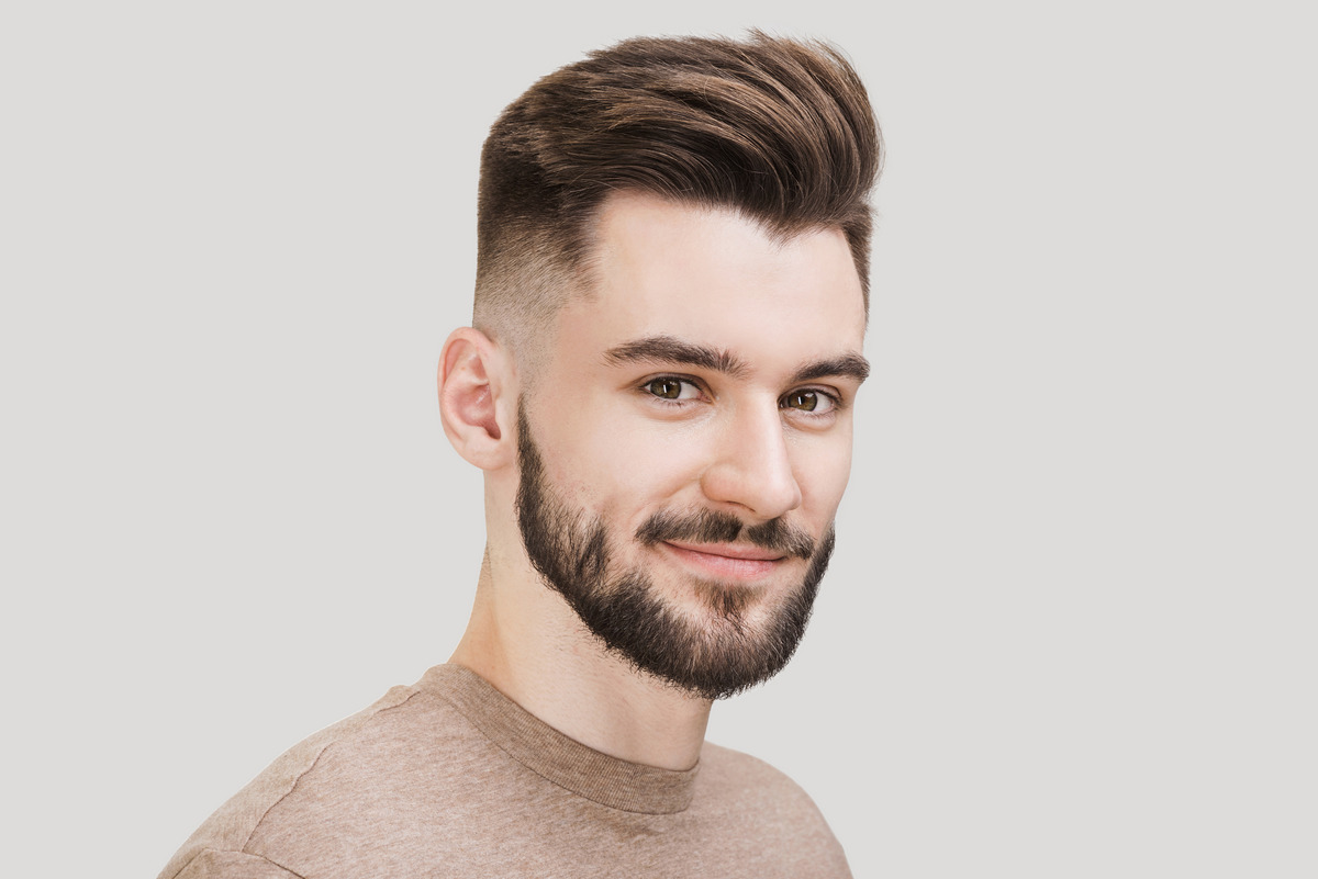 Man with haircut fades and beard