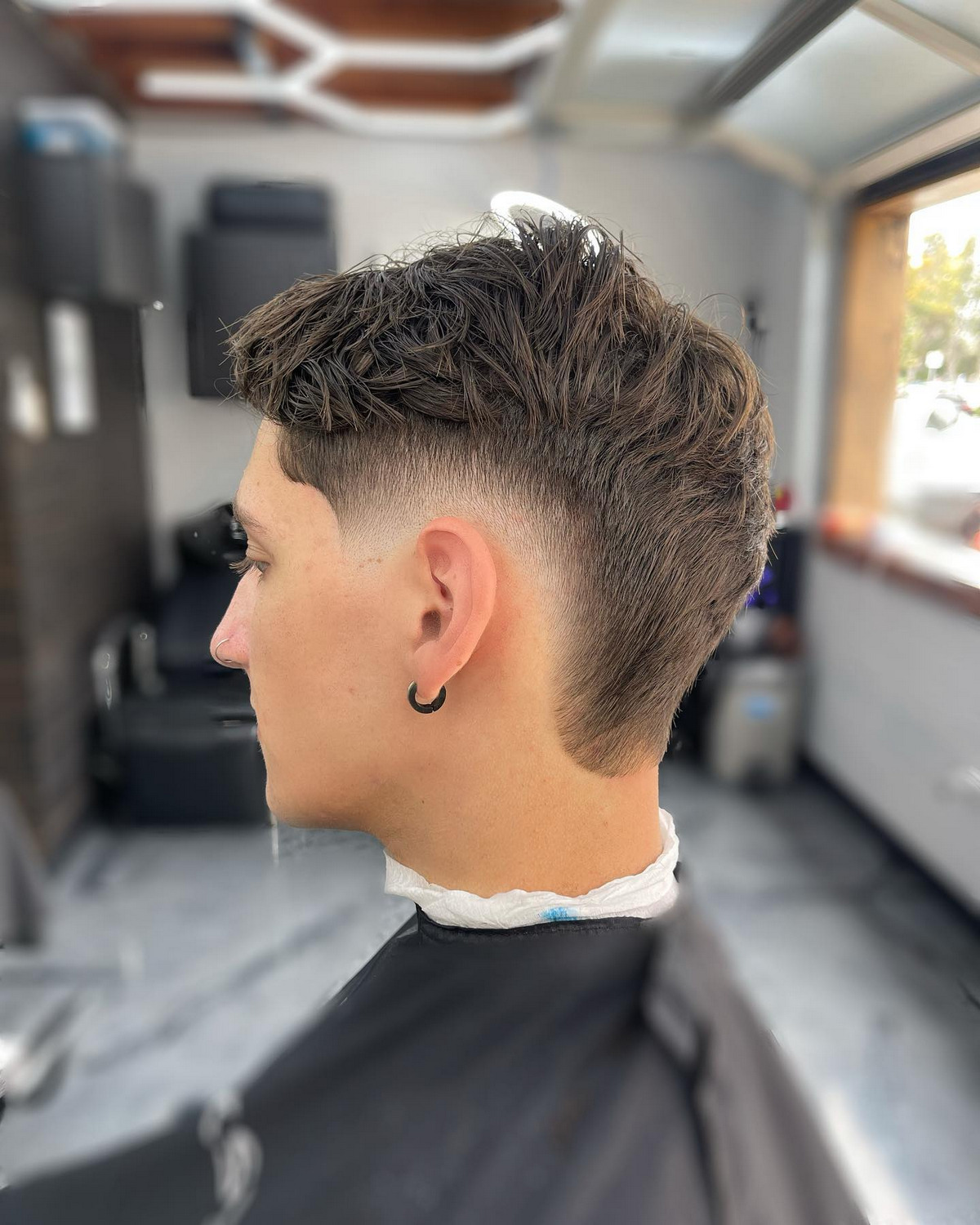 Men with burst fade with messy top hair
