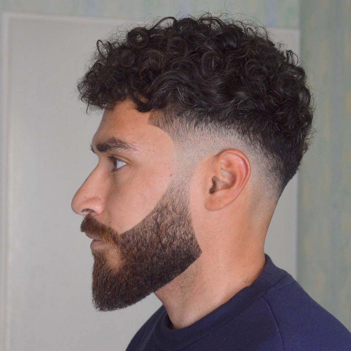 Men with curly top fade hair