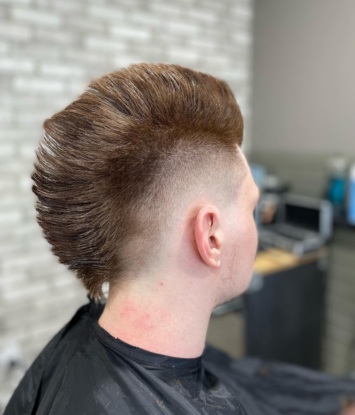 Men with mohawk fade hair