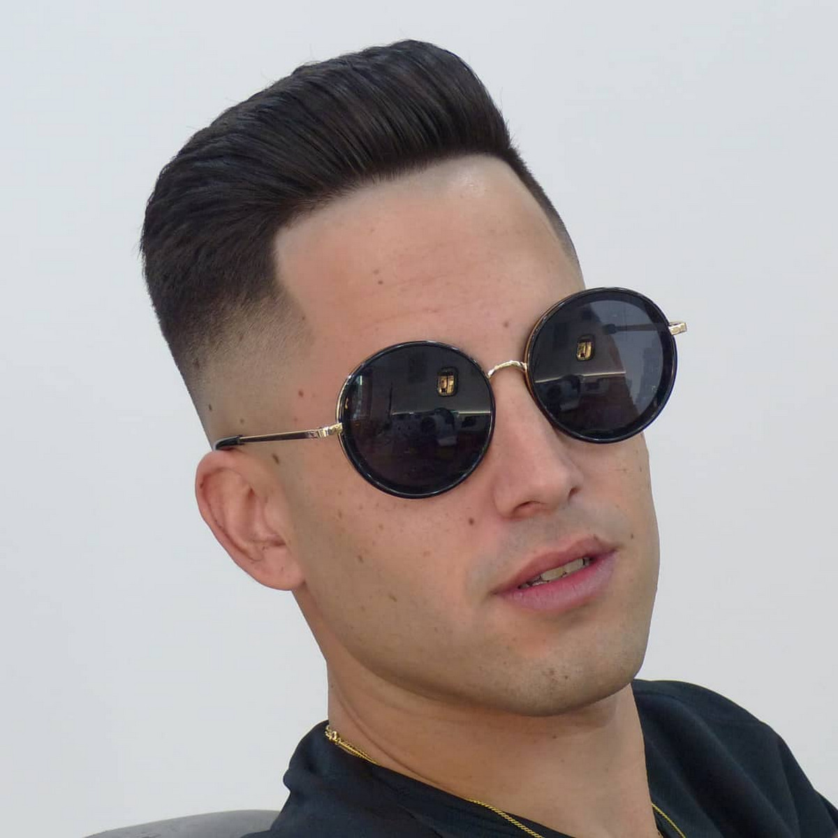 Men with slicked back fade hair