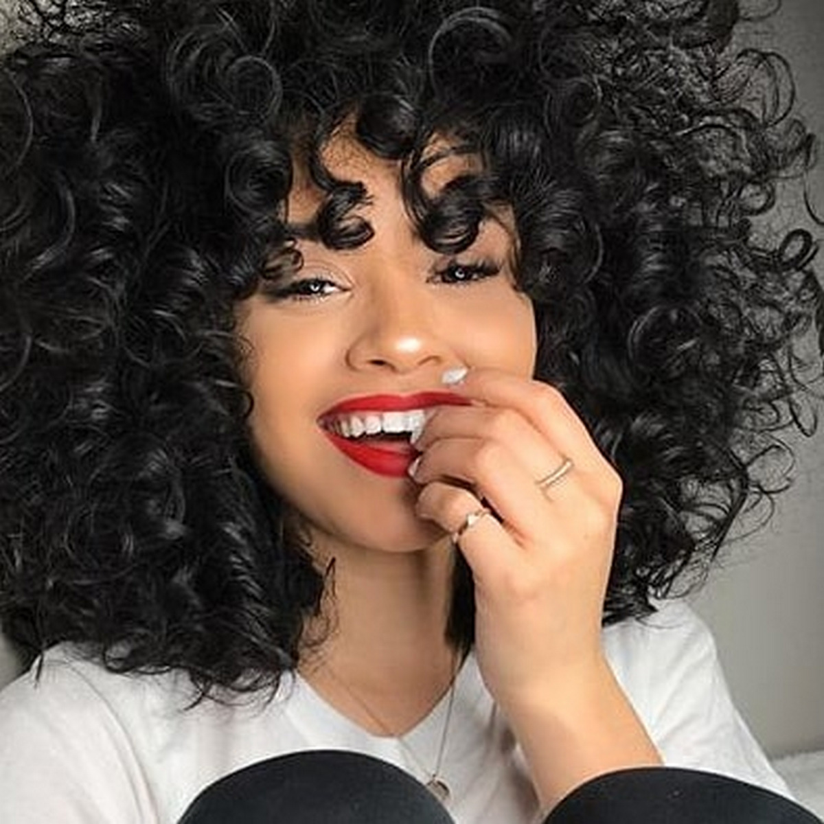 Natural curly hair and dynamic volume of the girl