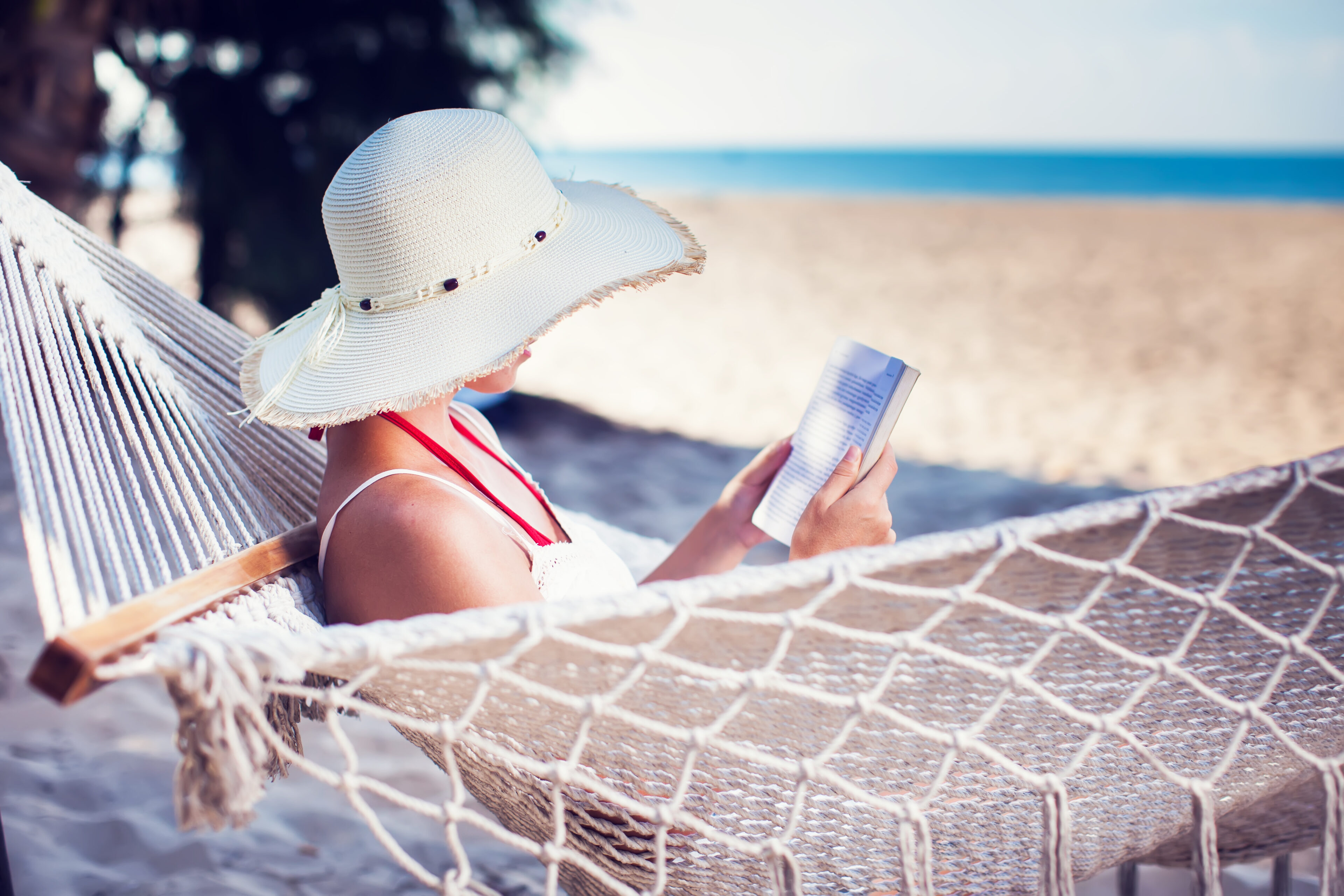 A girl with her sun hat to protect her hair from UV