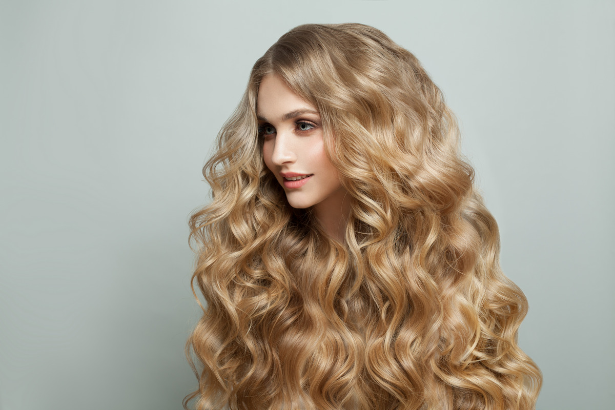 Smiling woman fashion model with long healthy hairstyle