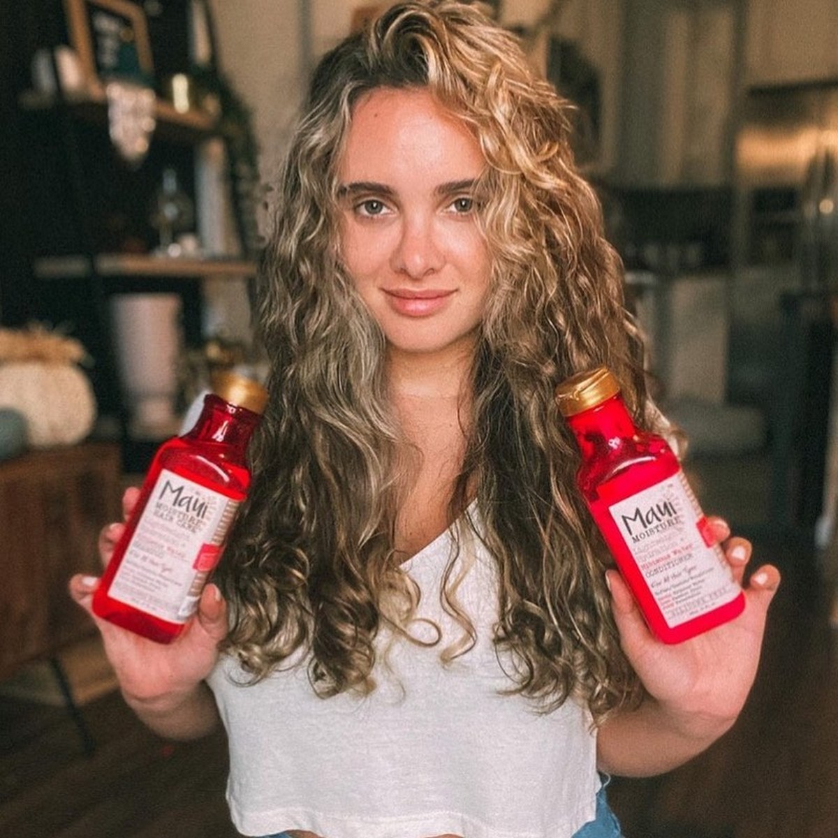 A young woman with her Maui Moisture products