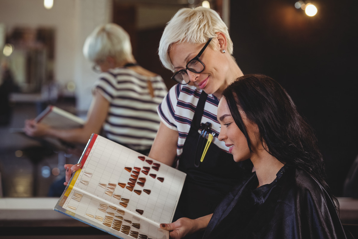 Specialist advising the customer on suitable hairstyles