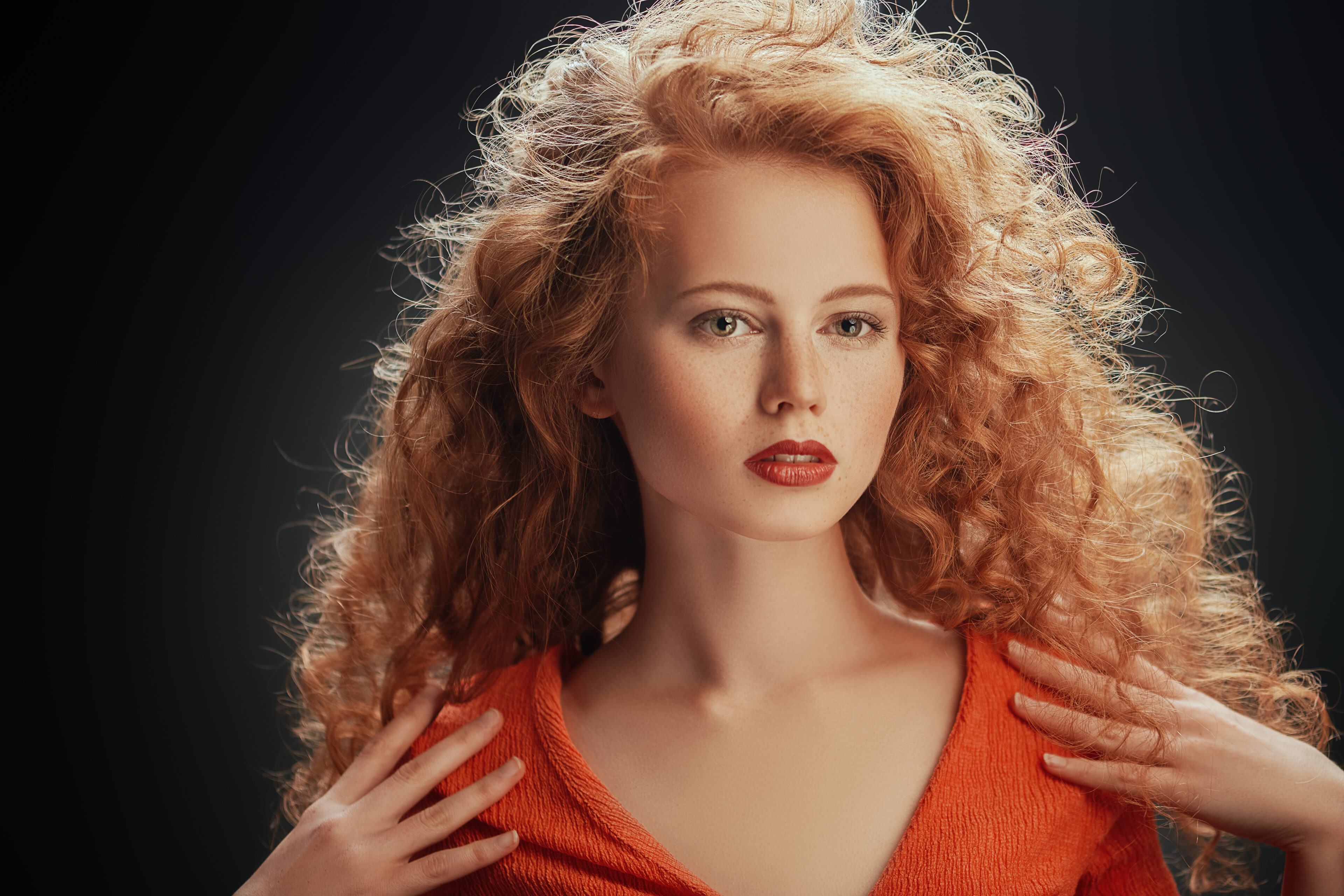 A beautiful girl with her dyed strawberry blonde hair